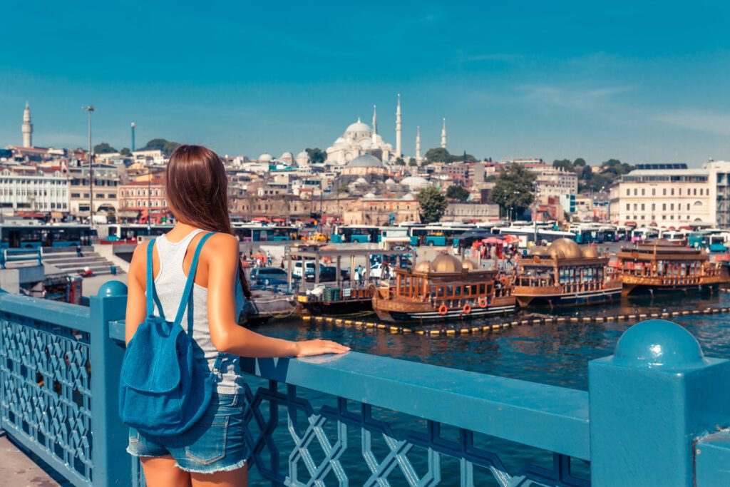 Young,Tourist,Woman,On,Galata,Bridge,,Golden,Horn,Bay,,Istanbul.