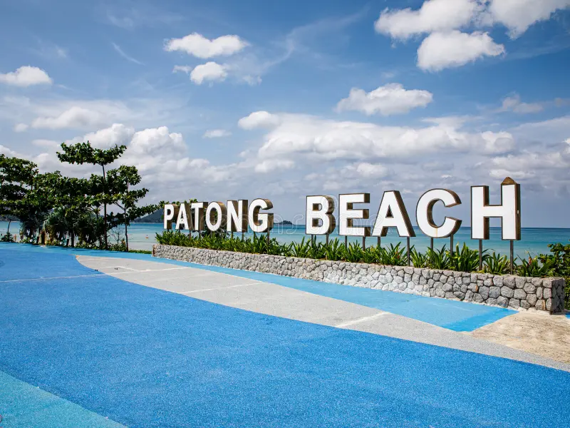 blue-embankment-signboard-patong-beach-sunny-day-phuket-thailand-blue-tile-embankment-palm-tree-sky-241122136